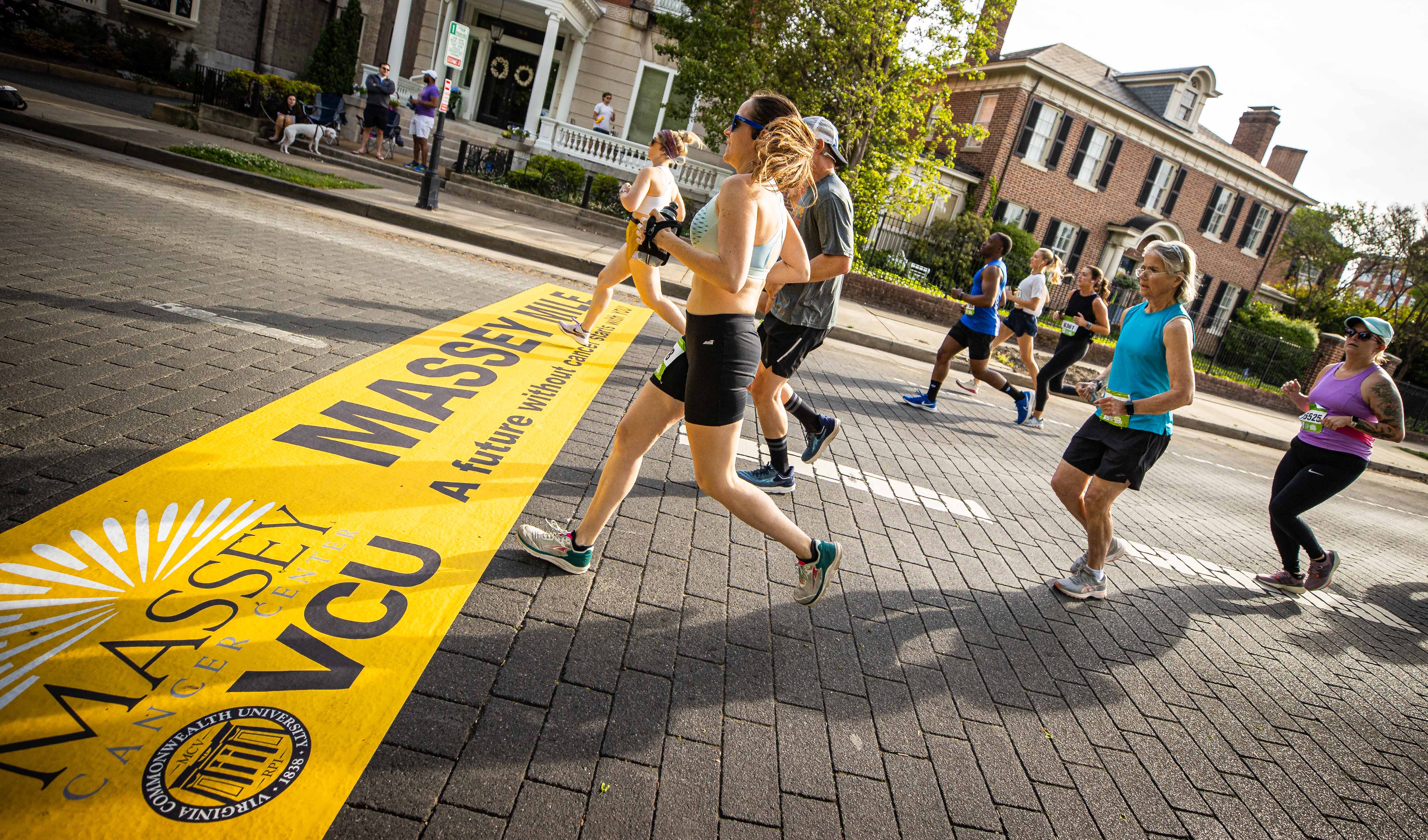 Group of runners crossing the Massey Challenge finish line