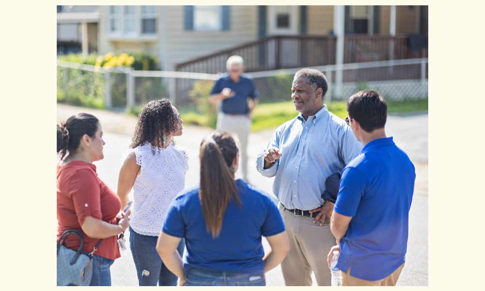 Summer 2023 - Massey director and Lipman Chair in Oncology Robert A. Winn, M.D., connects with the community during a District Walk.