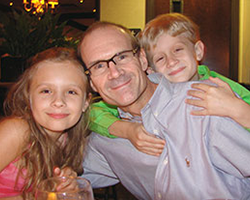 Jim Popp with two of his children