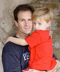 Jim Popp pictured holding his son