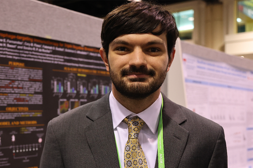 Matthew Fernandez, B.S., attends a poster session at the 2023 AACR annual conference