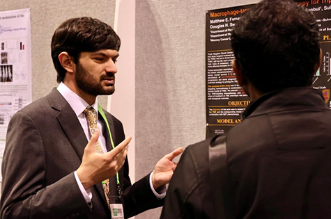 Matthew Fernandez, B.S., a Ph.D. student in the VCU School of Pharmacy, presents a poster at the 2023 AACR annual conference