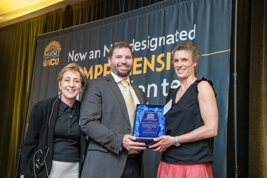 Andrew Poklepovic and Liz Boyd presented with award