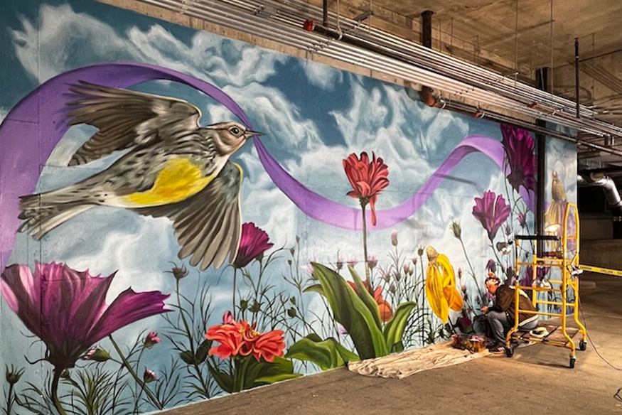 Vibrant mural of flowers and birds symbolizing hope