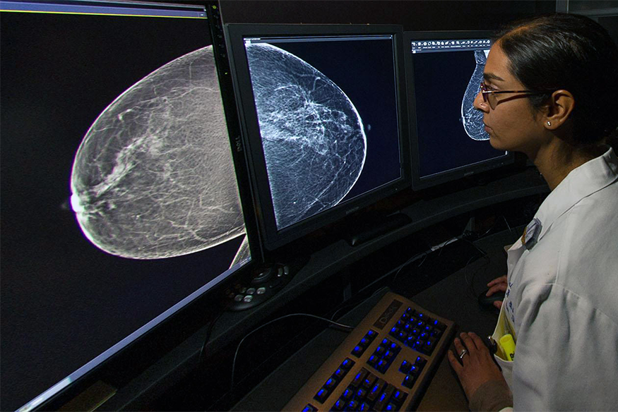 Massey physician reading breast scans on digital screens