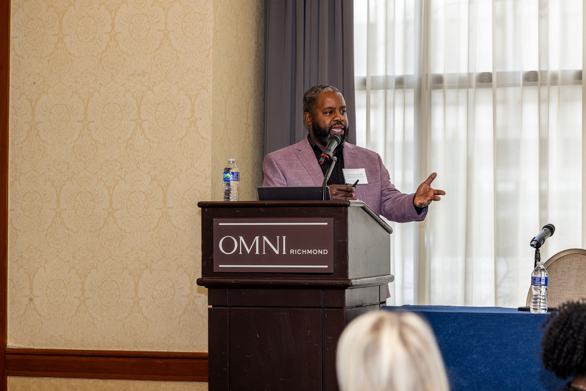 Man standing at podium with 