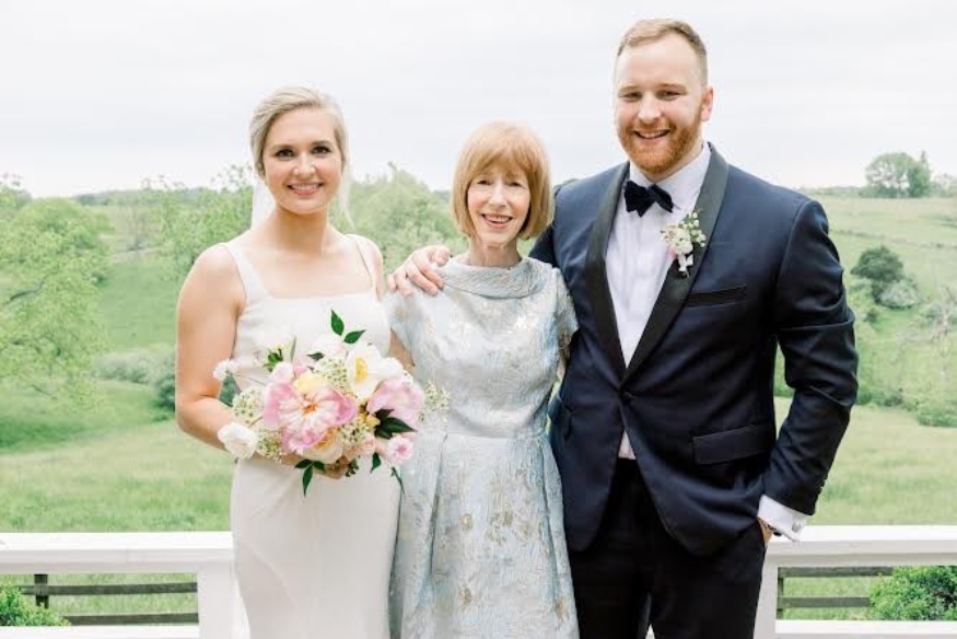 From left to right, Kendall, Katherine, and Christian in a photo at wedding