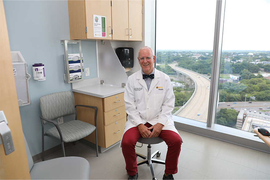 Scott Strayer posed in front of window