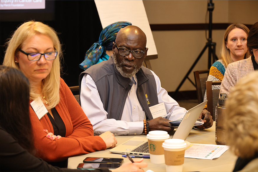 Taylor participates in a roundtable discussion.